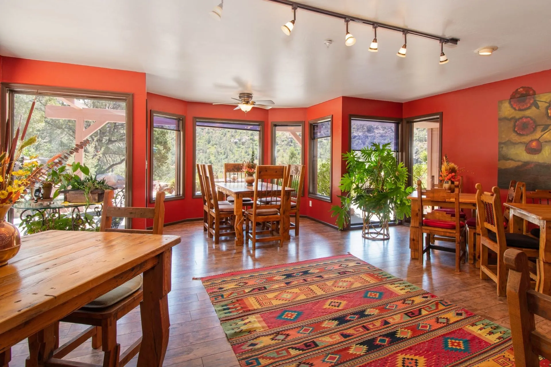Warm dining room with panoramic views of Sedona greenery